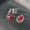 Sylus Red Zircon Bird & Feather Stud Earrings | Love and Deepspace